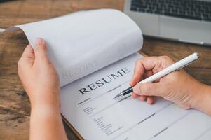 Individuals or recent grads looking for work and filling out a job application should first evaluate the application before applying for a position. photo