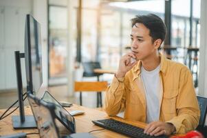 Young programmer working on coding, software development and web design in software company office.Concept technology development photo