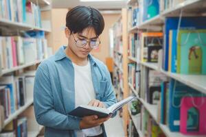 Students are reading and looking for books to study, make reports, find useful information on the bookshelves in the library. Concept of reading, learning and intelligence. photo