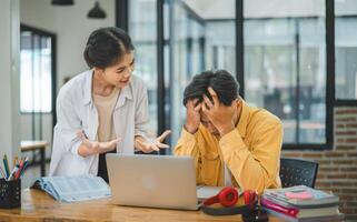 Young students quarrel when their work fails and goals are not met. , communication does not understand each other photo
