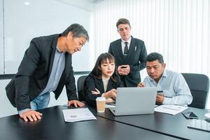 Business people team work while working in board room, design project, discussing ideas,discuss financial statistics together teamwork concept photo