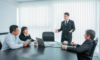 Business people team work while working in board room, design project, discussing ideas,discuss financial statistics together teamwork concept photo