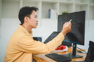 Young programmer working on coding, software development and web design in software company office.Concept technology development photo