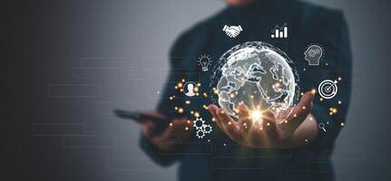 Businessman holding virtual Global Internet connection metaverse. Business global internet connection application technology and digital marketing.Financial and banking, Digital link tech photo