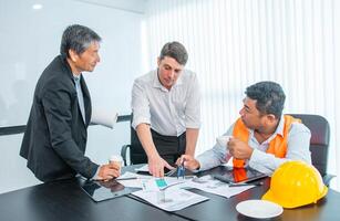 Business people team work while working in board room, design project, discussing ideas,discuss financial statistics together teamwork concept photo
