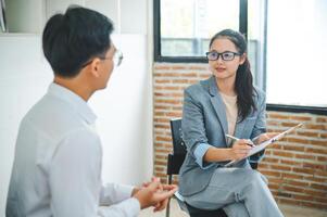 Psychologist listening to the problem of a patient with mental health problems, a patient for treatment encouragement Love and family problems, bipolar, depressed patients prevent suicide photo