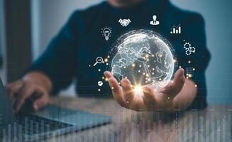 Businessman holding virtual Global Internet connection metaverse. Business global internet connection application technology and digital marketing.Financial and banking, Digital link tech photo