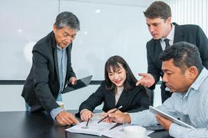 Business people team work while working in board room, design project, discussing ideas,discuss financial statistics together teamwork concept photo