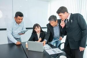 Business people team work while working in board room, design project, discussing ideas,discuss financial statistics together teamwork concept photo