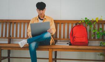 Students are doing research and finding knowledge on the internet on laptops in the university area. photo