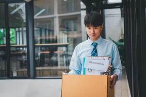 Young company employee stressed After resigning from work to find a new job , was fired by the company or when the employment contract expires, resulting in being unemployed photo