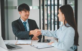 HR managers shake hands with job candidates, accept ideas, and agree to collaborate within the organization. photo