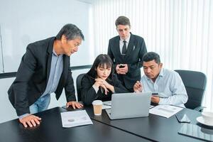 Business people team work while working in board room, design project, discussing ideas,discuss financial statistics together teamwork concept photo