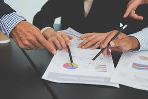 Business people team work while working in board room, design project, discussing ideas,discuss financial statistics together teamwork concept photo