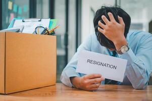 Young company employee stressed After resigning from work to find a new job , was fired by the company or when the employment contract expires, resulting in being unemployed photo