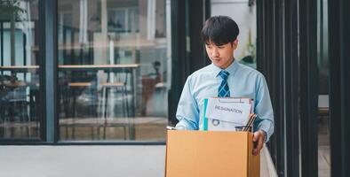 Young company employee stressed After resigning from work to find a new job , was fired by the company or when the employment contract expires, resulting in being unemployed photo