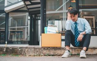 Young company employee stressed After resigning from work to find a new job , was fired by the company or when the employment contract expires, resulting in being unemployed photo