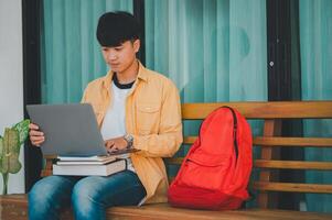 Students are doing research and finding knowledge on the internet on laptops in the university area. photo