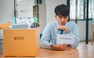 Young company employee stressed After resigning from work to find a new job , was fired by the company or when the employment contract expires, resulting in being unemployed photo