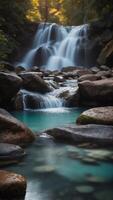 A waterfall cascading over smooth rocks, with an empty, glowing pool at the base. photo