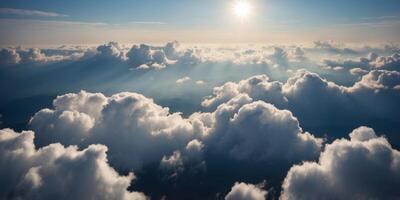 View of fluffy white clouds in a bright blue sky from above. photo