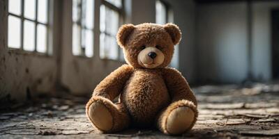 teddy bear lying in an abandoned building. photo