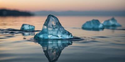 Iceberg Floating in Ocean Water with Reflection. photo