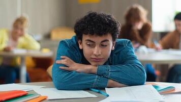 Tired sleepy napping exhausted fatigued overworked overload pupil teen boy teenager sleep student guy teenage generation man male schoolboy health problem boring class lesson sleeping at table school photo
