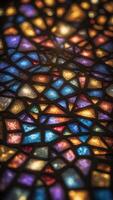 A kaleidoscope of stained glass patterns projected onto a floor from above. photo