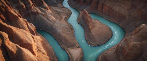Aerial View of a River Winding Through a Canyon with Layered Rock Formations. photo