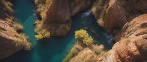 Aerial View of a Small Canyon with a Pool of Water. photo