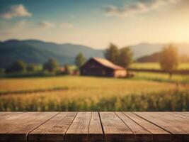Background of a blurry farm field and a rustic wooden table. photo