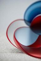 A red and blue background with a red line that is curved. photo
