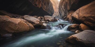 A stream flows through a narrow gorge between rugged coastal cliffs. photo