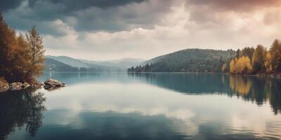 A serene lake scene with a cloudy sky and calm waters. photo