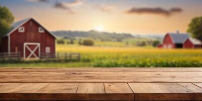 empty wooden table top for product display montages with blurred farm barns and buildings background. photo