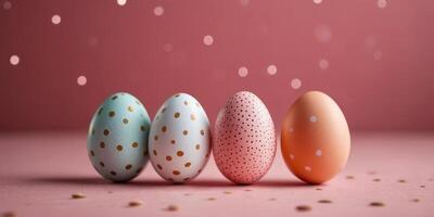 Three eggs with polka dots on them are sitting on a pink background. photo