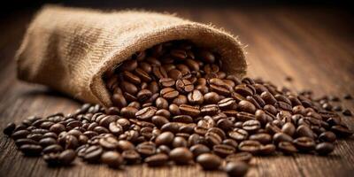 Coffee Beans Spilling from a Burlap Sack. photo
