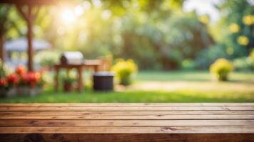 empty wooden table on blurred garden background with barbecue grill in summer. photo