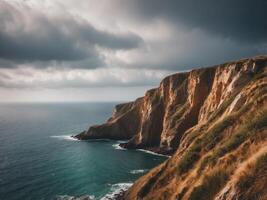Coastal Cliffs and a Tranquil Sea Under a Cloudy Sky. photo