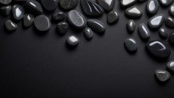 The black stone background from a top view provides a free copy space image. photo