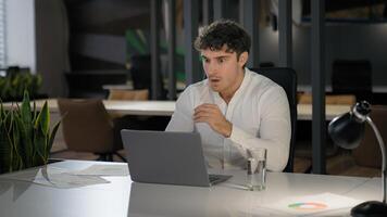 Shocked Caucasian businessman with laptop failure in office business man shock problem fail lose online trouble company crisis male professional computer stress worker bankrupt browsing pc crash error photo
