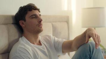 Caucasian European man pensive thoughtful thinking sadness bored bedroom bed home male tired guy failure grief loneliness upset sigh contemplation boredom reflection solitude frustration exhaustion photo