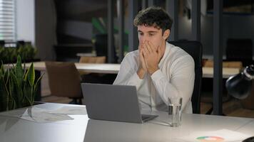 Shocked Caucasian businessman with laptop failure in office business man shock problem fail lose online trouble company crisis male professional computer stress worker bankrupt browsing pc crash error photo