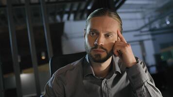 Night evening office deadline late time overworked overtime working dizzy Caucasian businessman feel headache pain head migraine ache with papers document problem business trouble man tired paperwork photo
