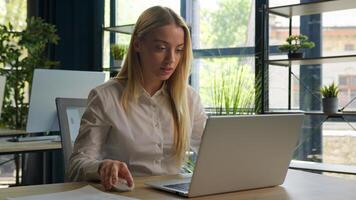 Caucasian woman working with business project online typing email on laptop at office smiling happy female businesswoman manager browsing internet computer e-commerce work studying cheerful girl smile photo