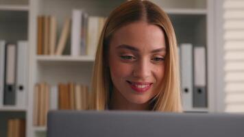 Happy smiling woman working online successful business work with laptop home office student girl university library e-learning education good exam result typing computer smile businesswoman using pc photo
