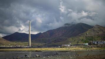 Oil refinery and a factory for obtaining silver on the shore of the Great Salt Lake against the backdrop of mountains and clouds. Utah, US video