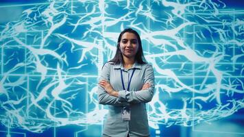Portrait of smiling technician running artificial intelligence programming scripts. Joyful admin working in IT department tasked with AI applications development, camera B photo