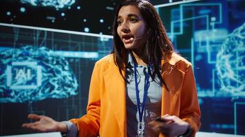 Speaker talking with audience on stage at AI conference bringing together leading experts and researchers to explore latest developments in artificial intelligence and machine learning, camera B photo